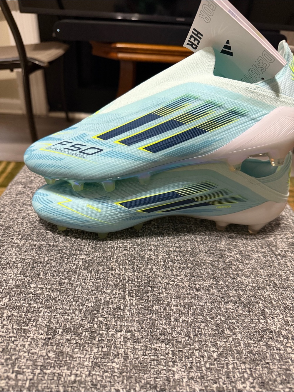 adidas women’s Soccer Cleats in Light Blue with Navy & Yellow Accents